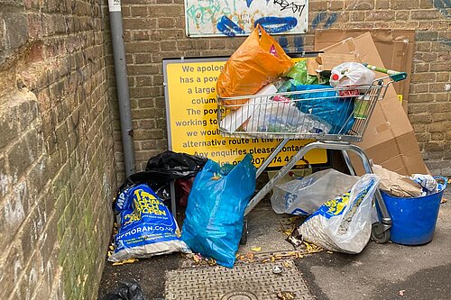 streetlight information sign obscured by rubbish in Billy Fury Way