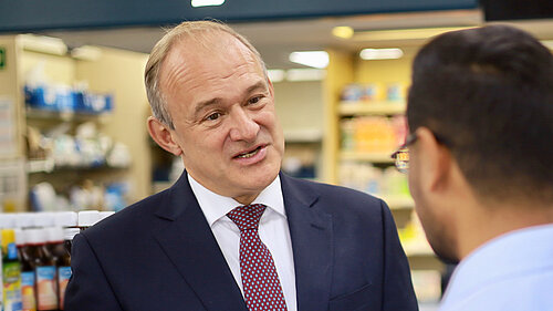 Ed Davey speaking to a man