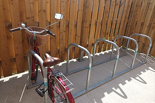 Single Bicycle in bike rack.
