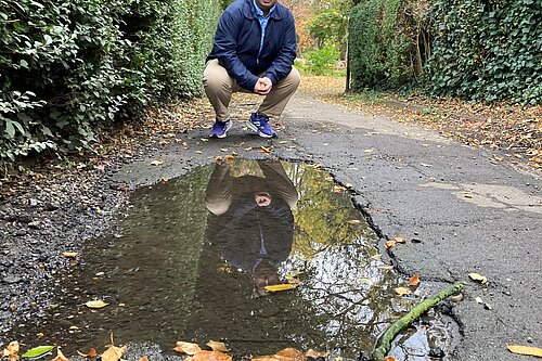 Matt Mellor on the damaged foothpath on Elers Road.