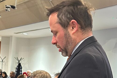 Cllr Gary Malcolm speaking at a Council meeting.