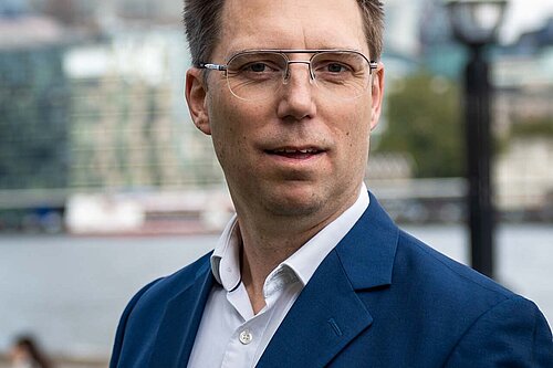 Rob Blackie pictured with a white shirt and navy blazer.