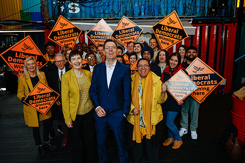 Rob Blackie and Liberal Democrat activists pictured with signs