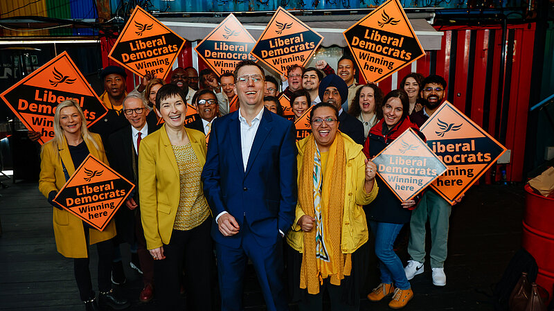 Rob Blackie and Liberal Democrat activists pictured with signs